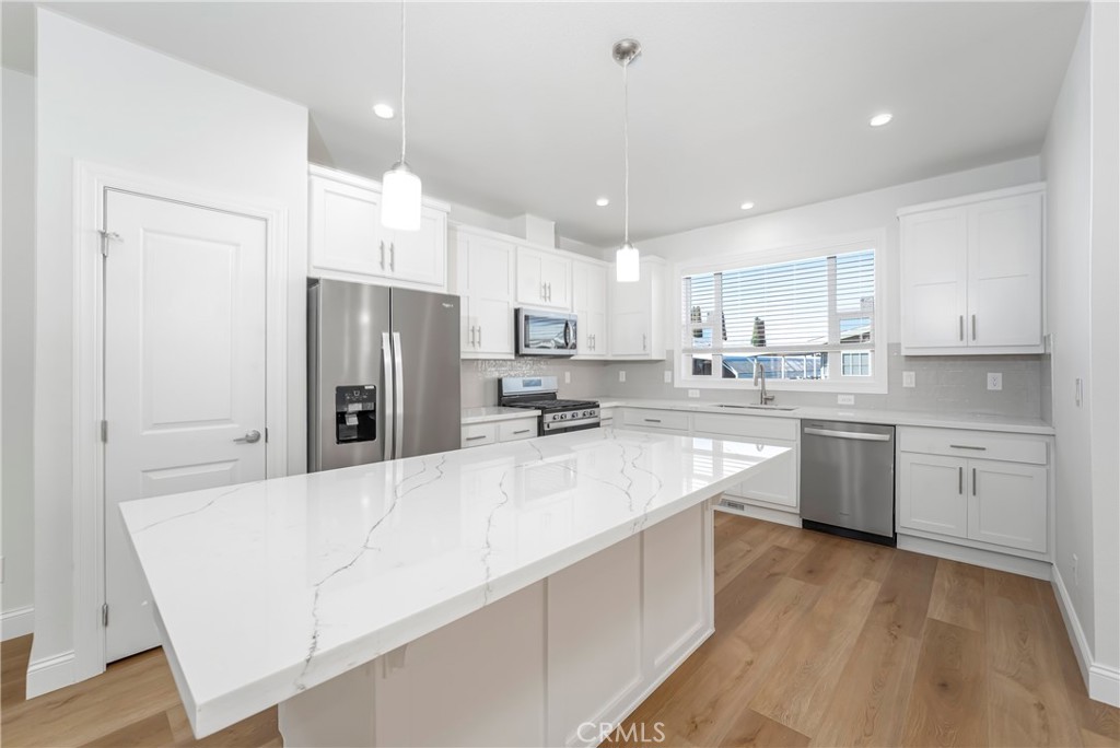 14851 Jeffrey Road, Unit 145 Irvine, CA 92618 - Photo 11 of 32 Island kitchen with pantry