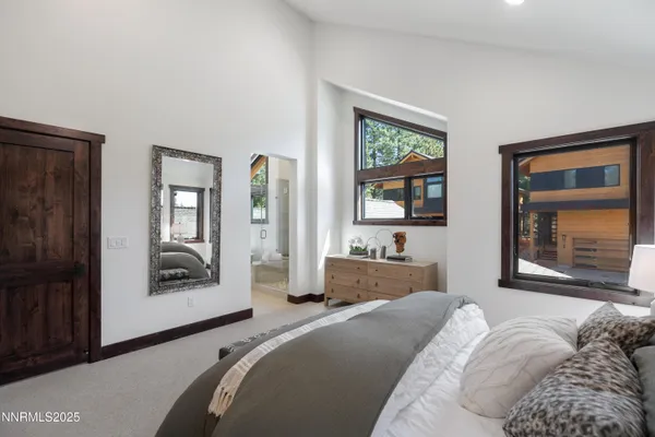 a bedroom with a bed and cabinets