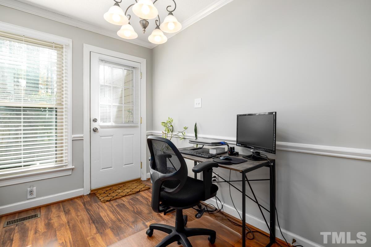 1202 Shadow Bark Court Raleigh, NC 27603 - Photo 12 of 27 a view of a workspace with furniture and a window