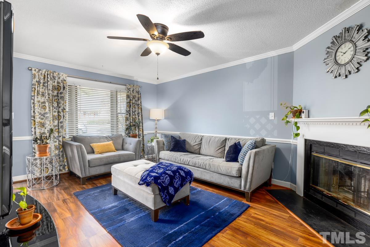 1202 Shadow Bark Court Raleigh, NC 27603 - Photo 14 of 27 a living room with furniture and a fireplace