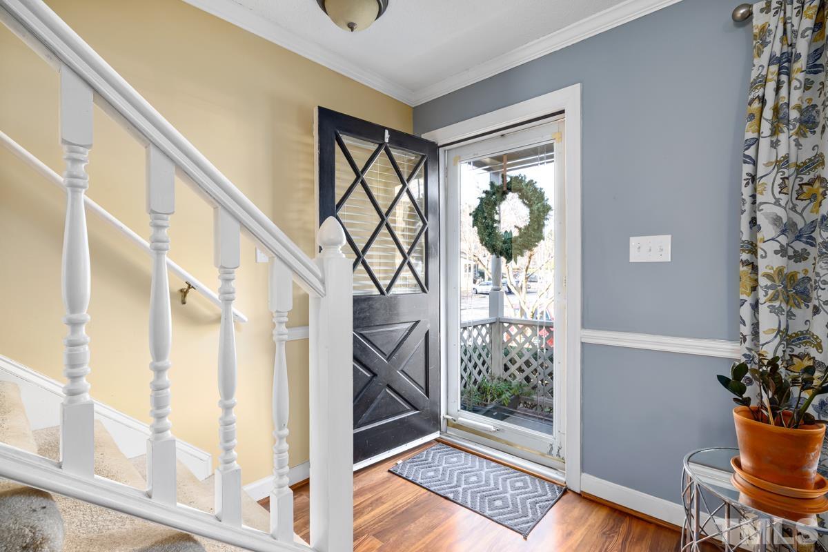 1202 Shadow Bark Court Raleigh, NC 27603 - Photo 16 of 27 a view of entryway with wooden floor and front door