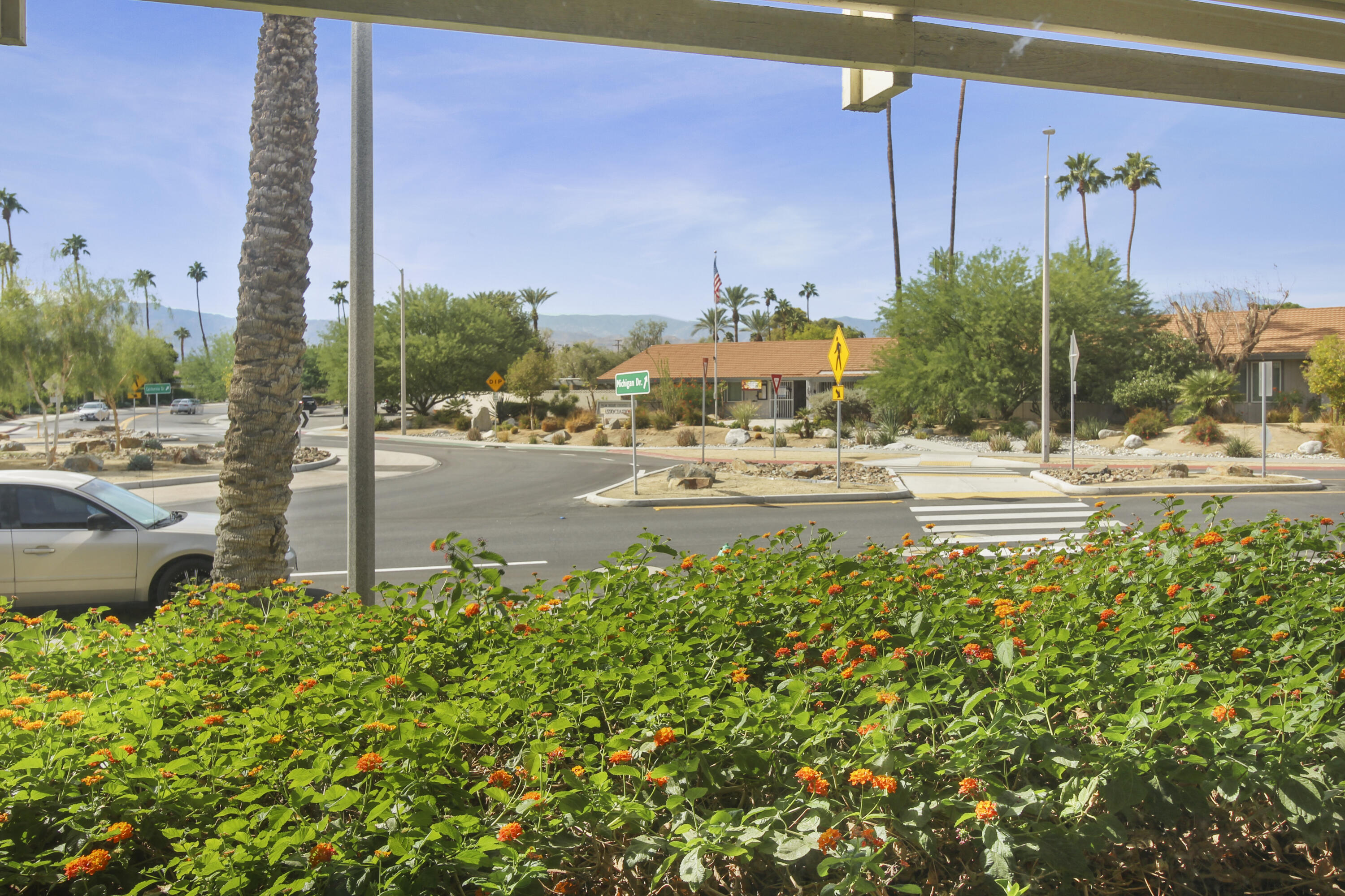 77912 Michigan Drive, Unit A2 Palm Desert, CA 92211 - Photo 5 of 12 a view of a street with a building in the background
