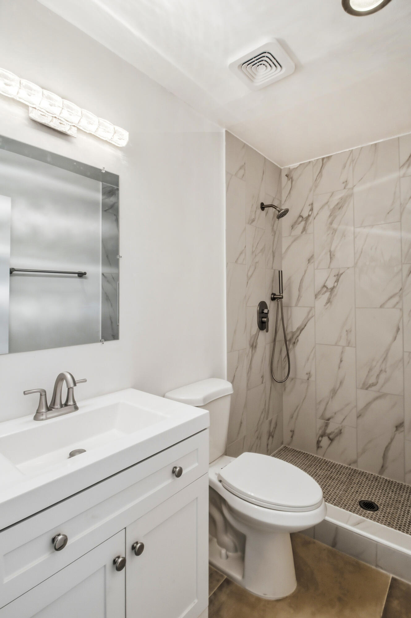 77912 Michigan Drive, Unit A2 Palm Desert, CA 92211 - Photo 9 of 12 a bathroom with a sink a toilet and shower