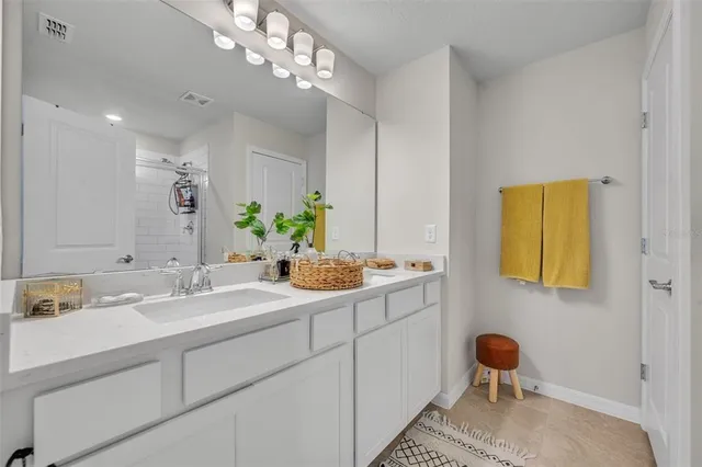 a bathroom with a sink and a mirror