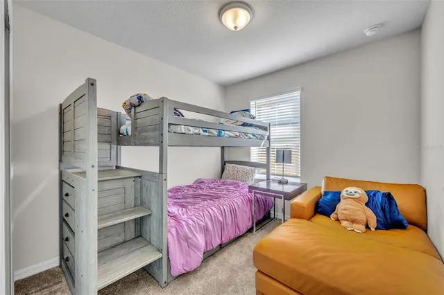 a bedroom with two beds and painted walls