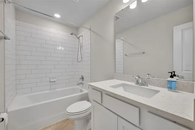 a bathroom with a sink a toilet and a bathtub