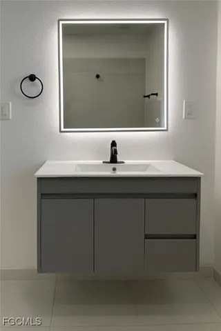 a bathroom with a toilet a sink and shower