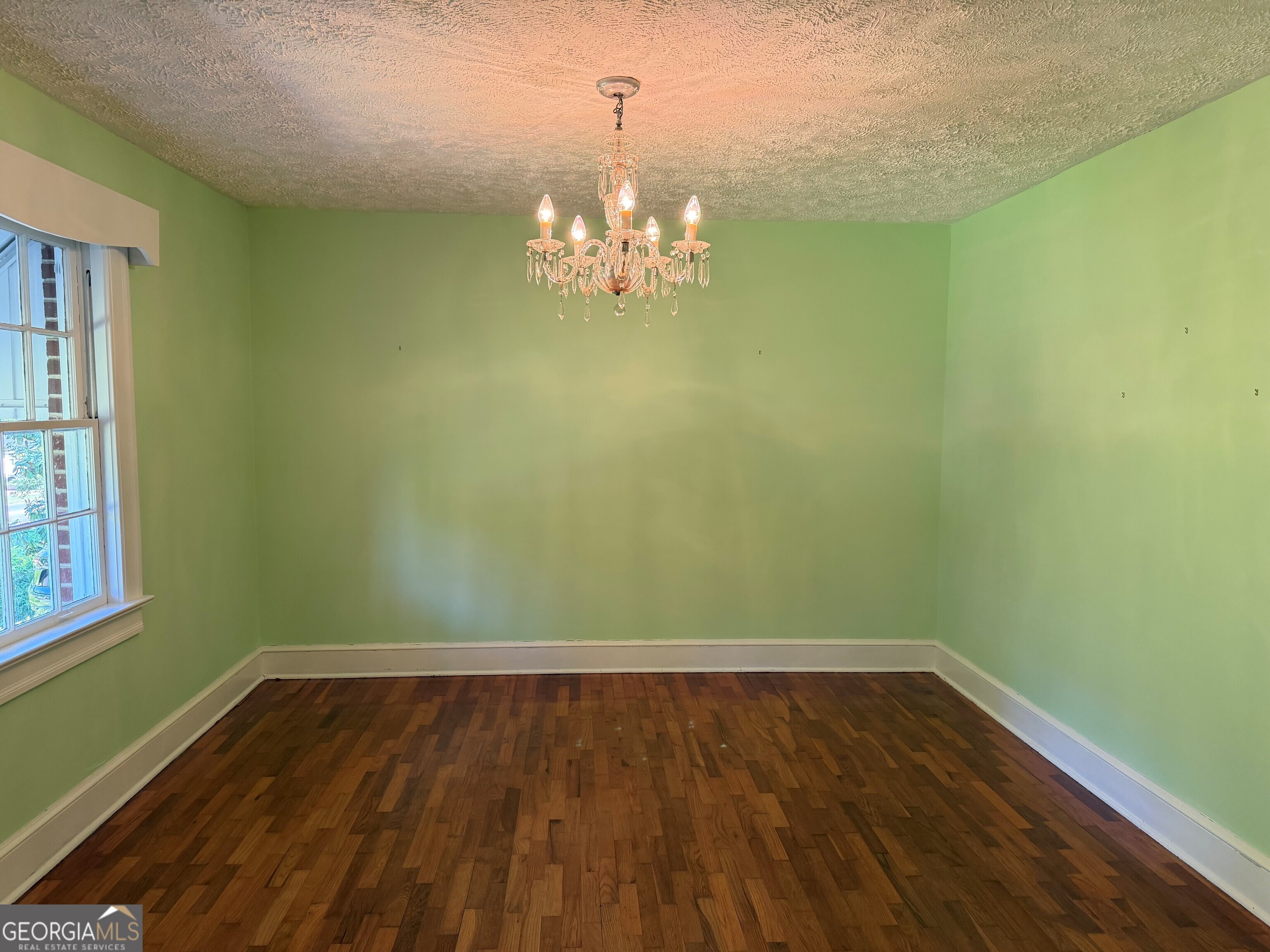 2619 Maple Road Southeast Rome, GA 30161 - Photo 27 of 31 a room with wooden floor and natural light