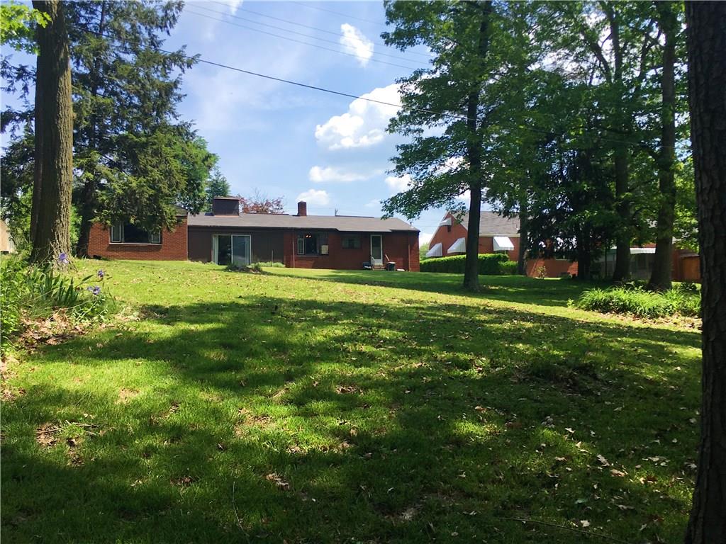 2859 Brodhead Road Aliquippa, PA 15001 - Photo 20 of 23 Backyard from edge of tree line. Plenty of room for a fire pit and volleyball net.