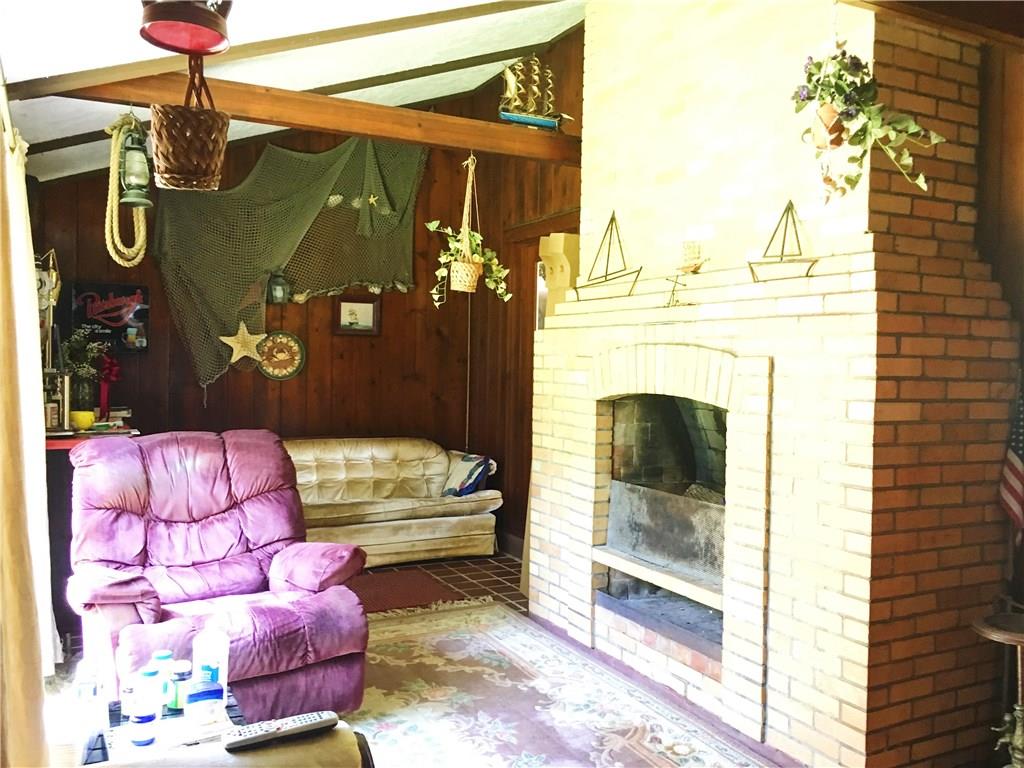 2859 Brodhead Road Aliquippa, PA 15001 - Photo 6 of 23 FAMILY ROOM - Alternate view of Family Room. Slider to left. Large brick wood burning fireplace.