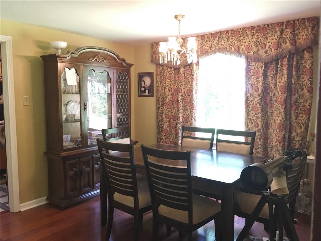 2859 Brodhead Road Aliquippa, PA 15001 - Photo 7 of 23 DINING ROOM - Formal Dining Room with large window facing the spacious backyard. Neutral tones, newer hardwood floors.