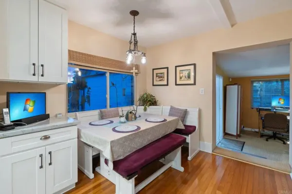 a very nice looking dining room with a table and chairs