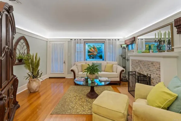 a living room with furniture and a fireplace