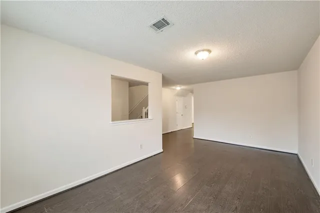 an empty room with mirror