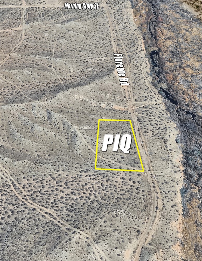 0 Floreate Road Adelanto, CA 92301 - Photo 2 of 7 a sign that is on the side of a brick wall