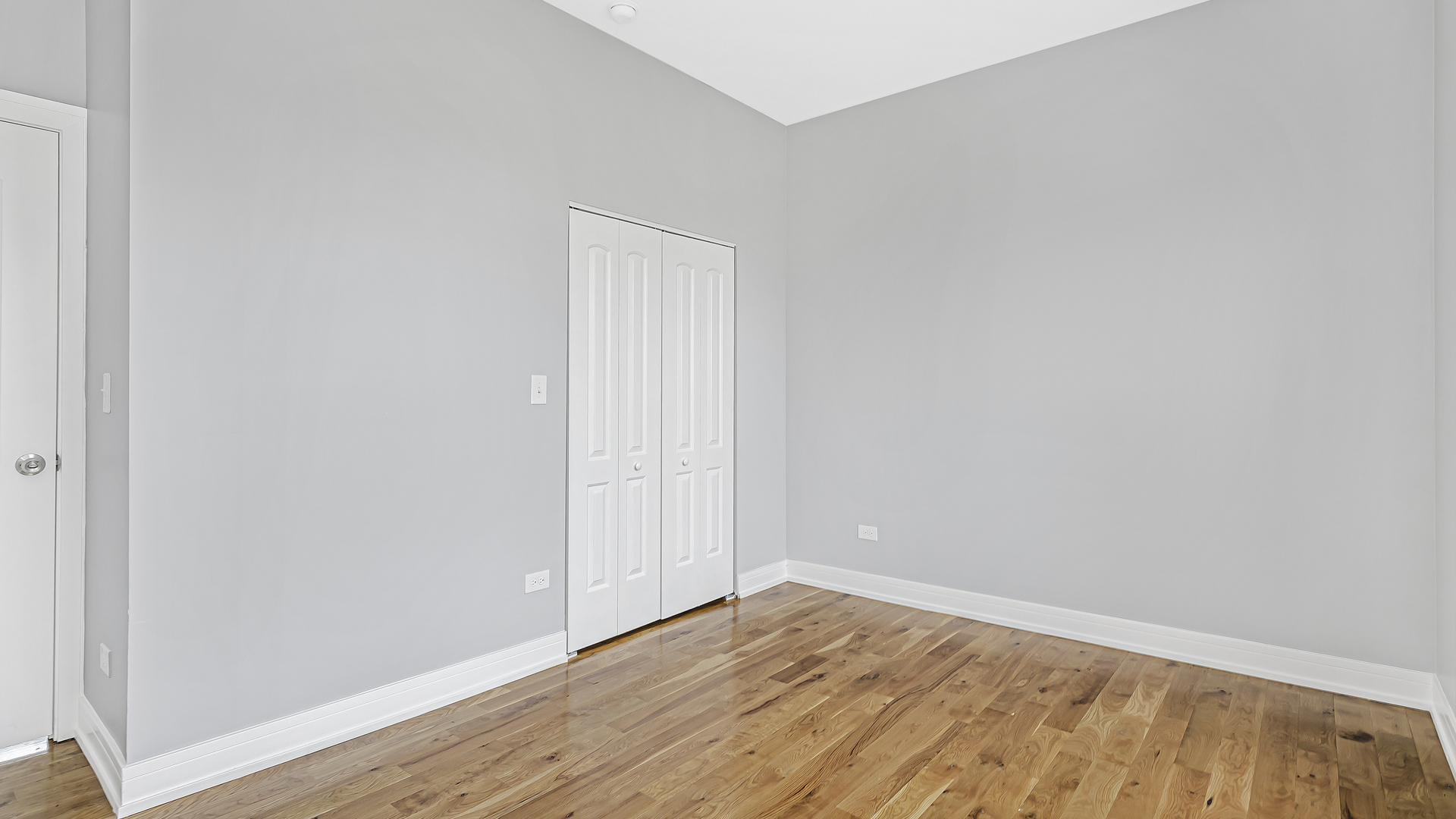 342 East 50th Street, Unit 1 Chicago, IL 60615 - Photo 11 of 16 a view of an empty room with wooden floor