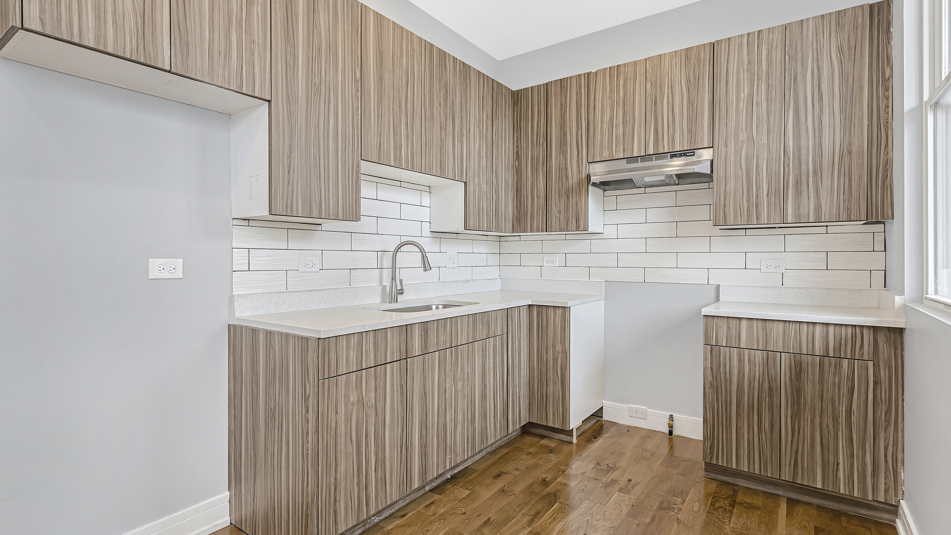 342 East 50th Street, Unit 1 Chicago, IL 60615 - Photo 2 of 16 a bathroom with a sink a mirror and shower
