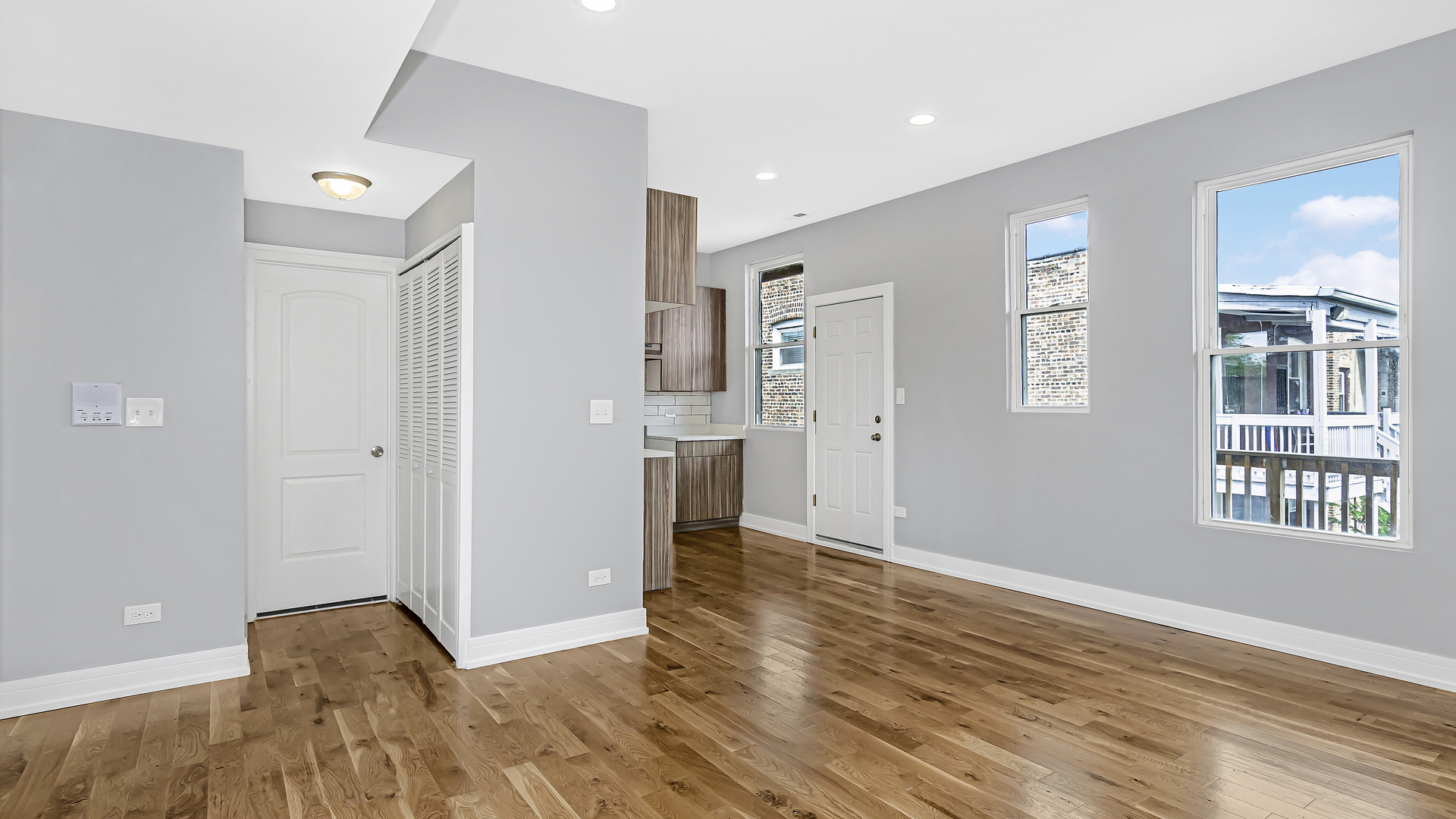 342 East 50th Street, Unit 1 Chicago, IL 60615 - Photo 5 of 16 a view of livingroom with hardwood floor and a kitchen