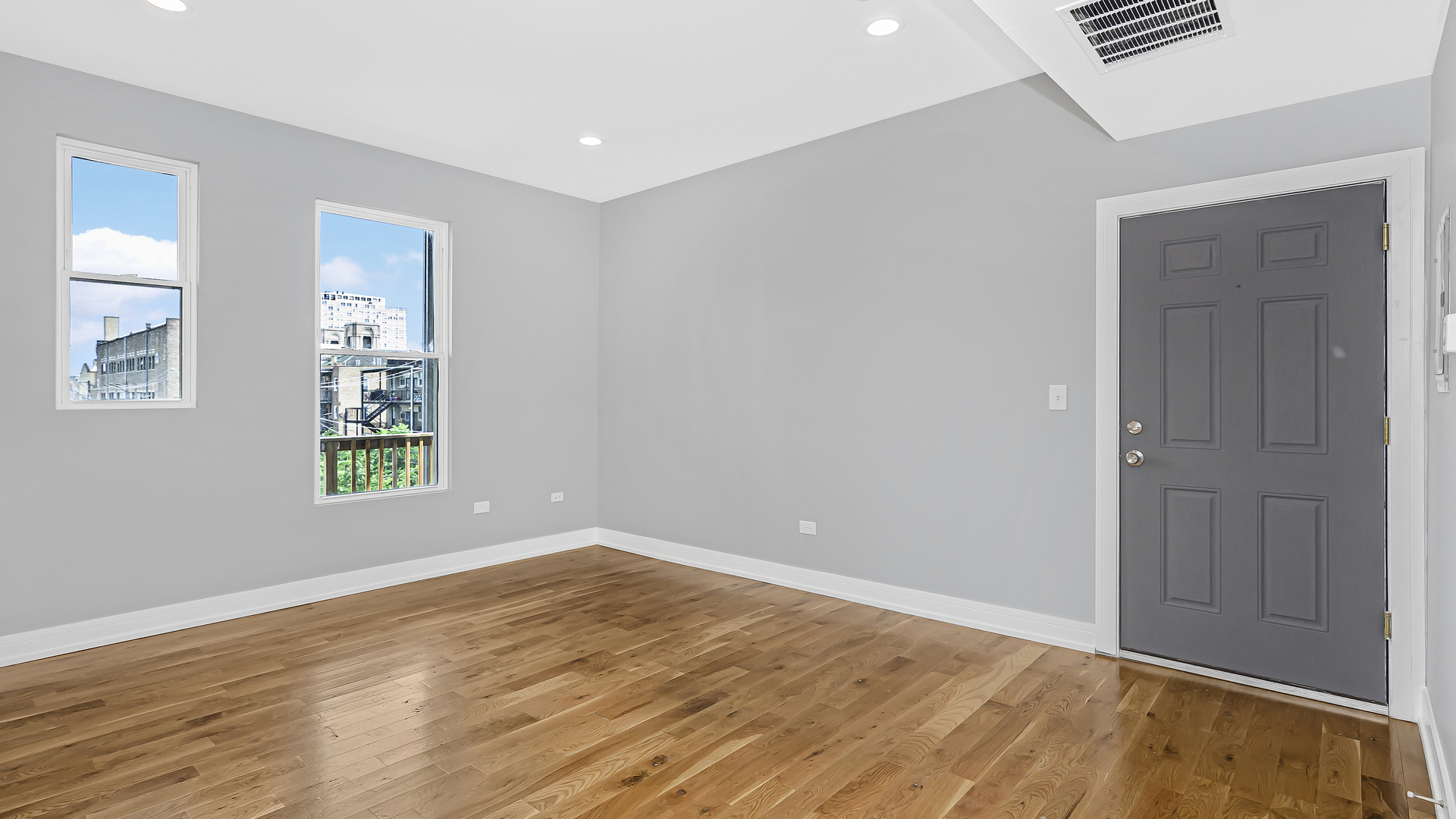 342 East 50th Street, Unit 1 Chicago, IL 60615 - Photo 7 of 16 a view of an empty room with wooden floor and a window