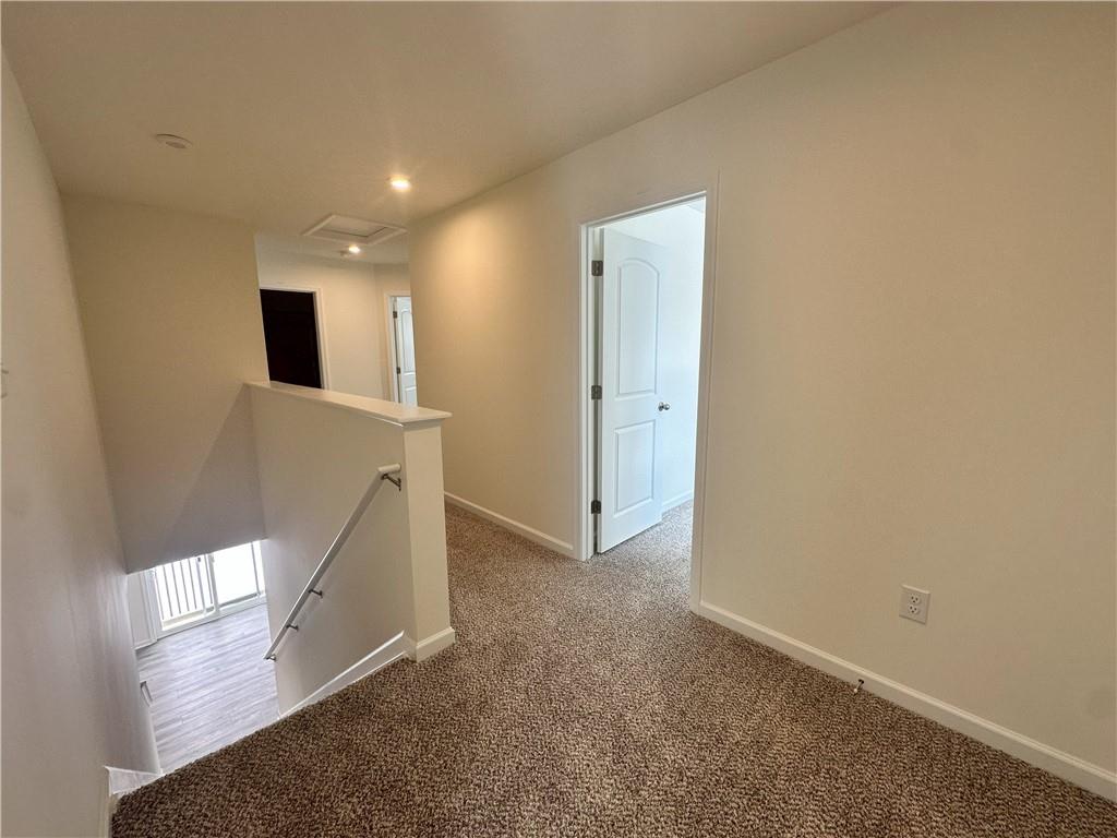 121 Marginal Road Hunker, PA 15639 - Photo 15 of 34 an empty room with wooden floor and windows