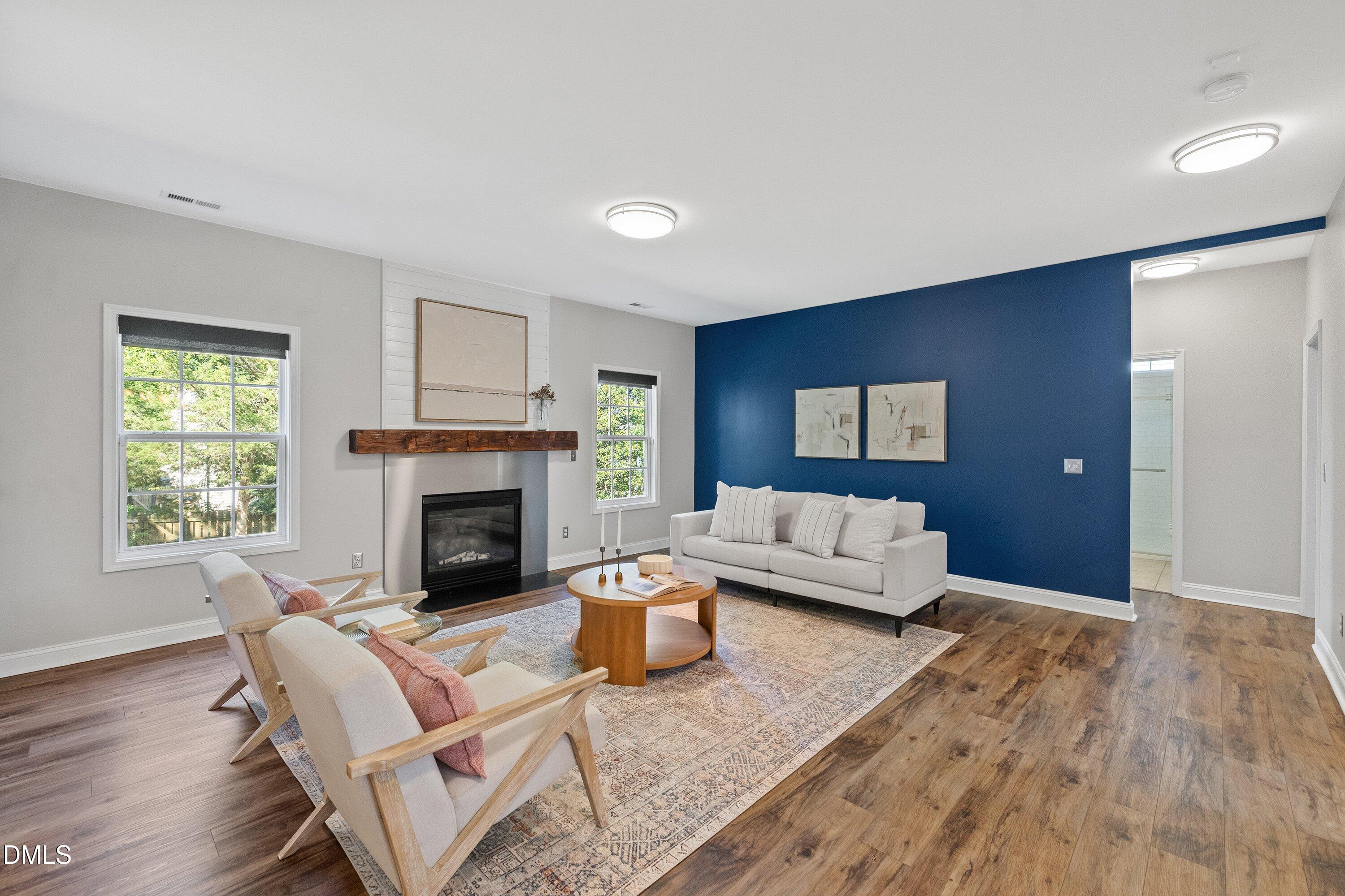 3717 Windmeade Road Wake Forest, NC 27587 - Photo 14 of 51 a living room with furniture and a fireplace