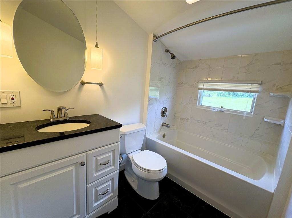 122 Browns Hill Road Valencia, PA 16059 - Photo 10 of 18 a bathroom with a sink a toilet and a mirror