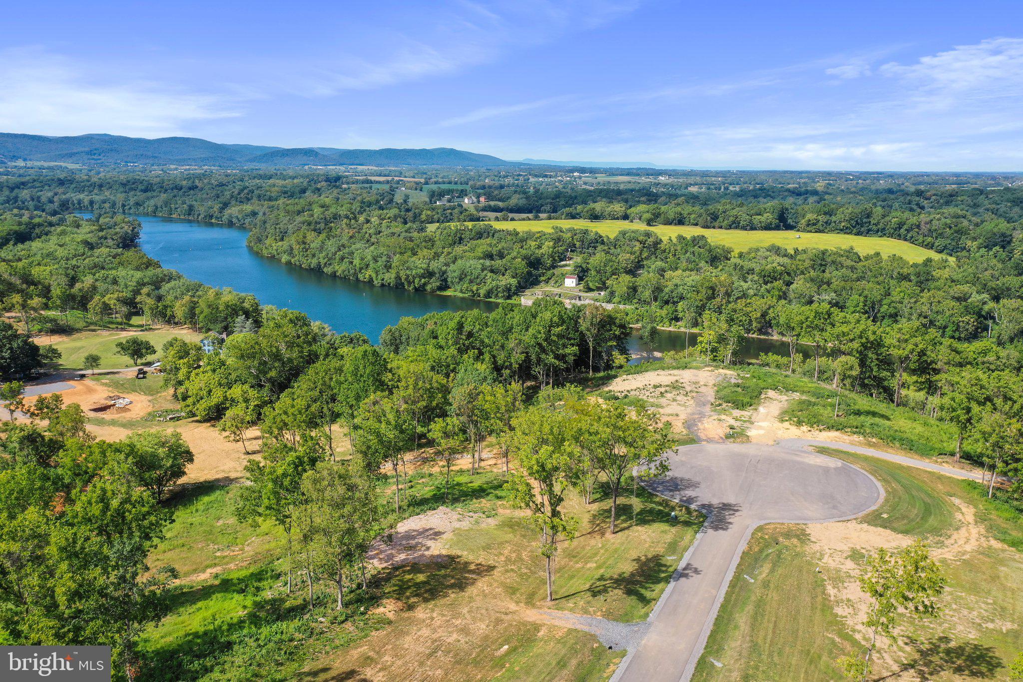 2 Bella Vista Falling Waters, WV 25419 - Photo 16 of 39 a view of lake with mountain in background