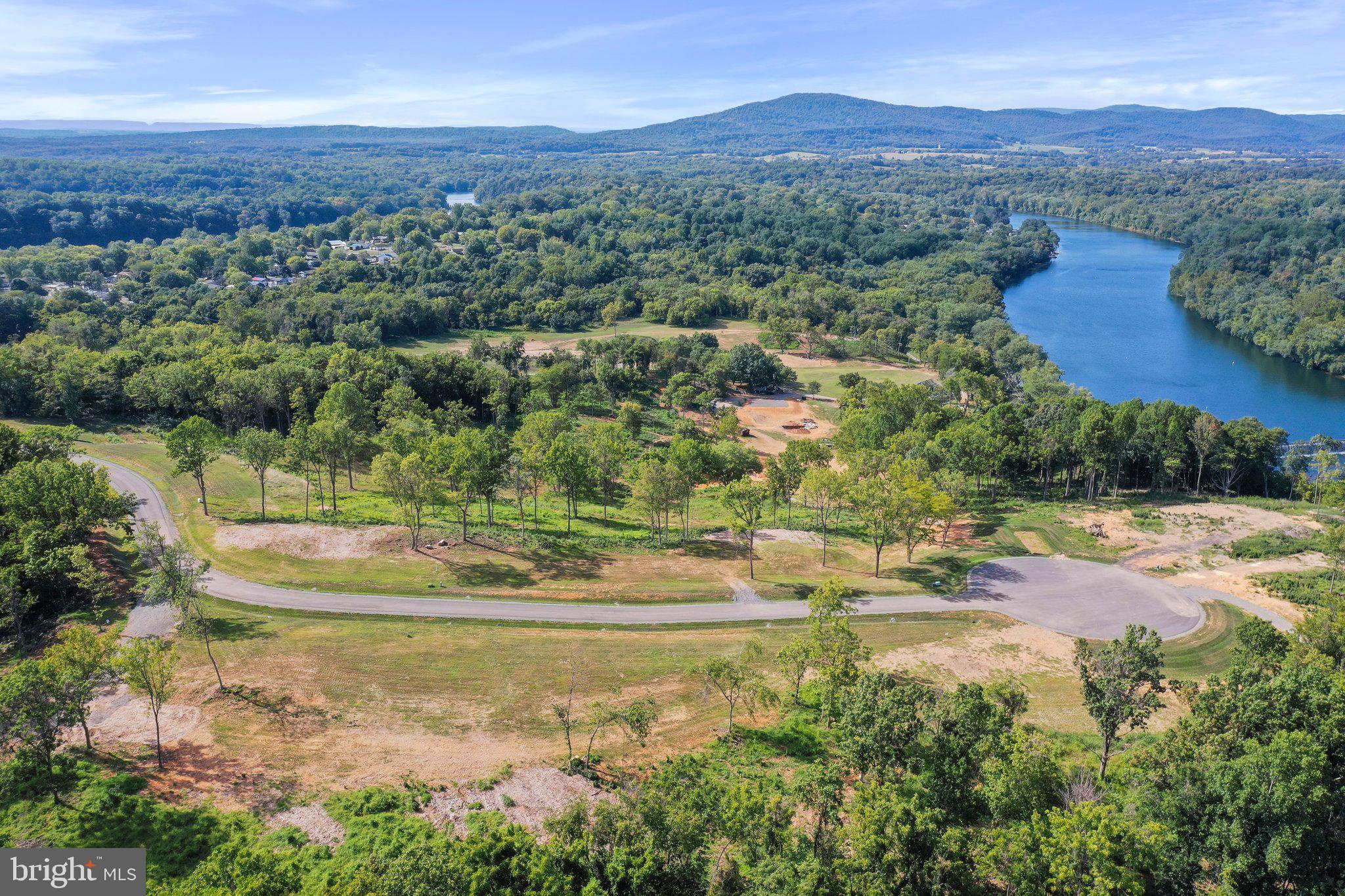 2 Bella Vista Falling Waters, WV 25419 - Photo 20 of 39 an aerial view of a houses with a yard and lake view