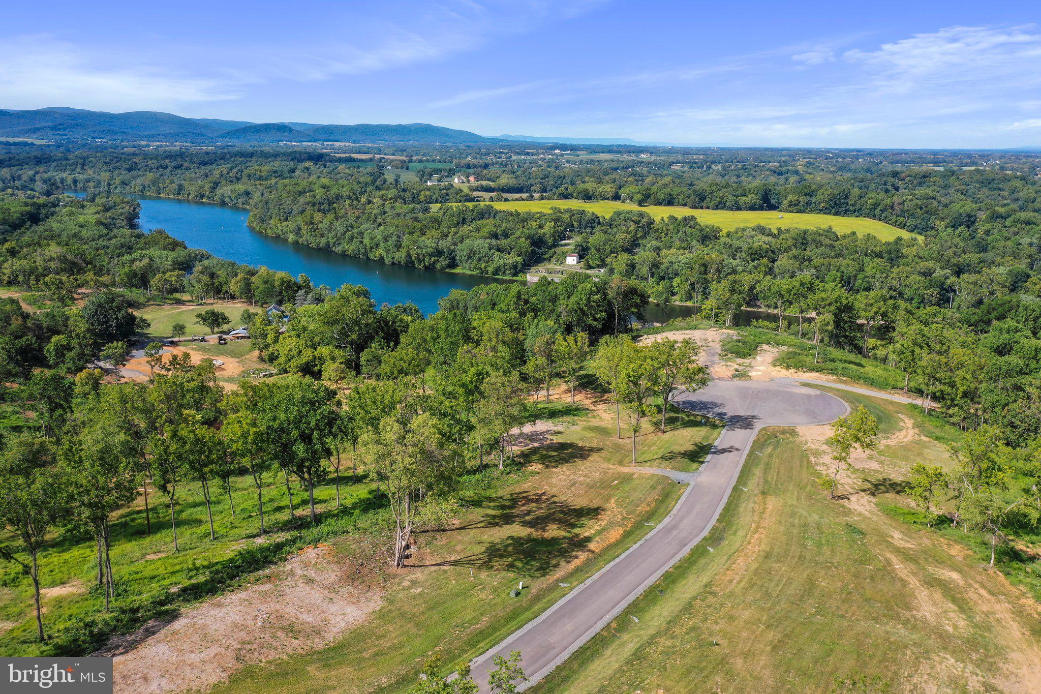 2 Bella Vista Falling Waters, WV 25419 - Photo 25 of 39 a view of a city from a lake