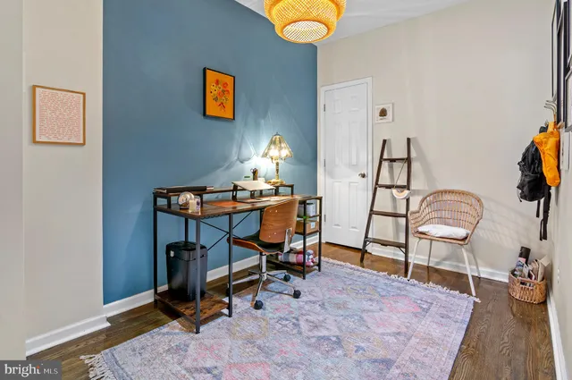 a view of a workspace with furniture