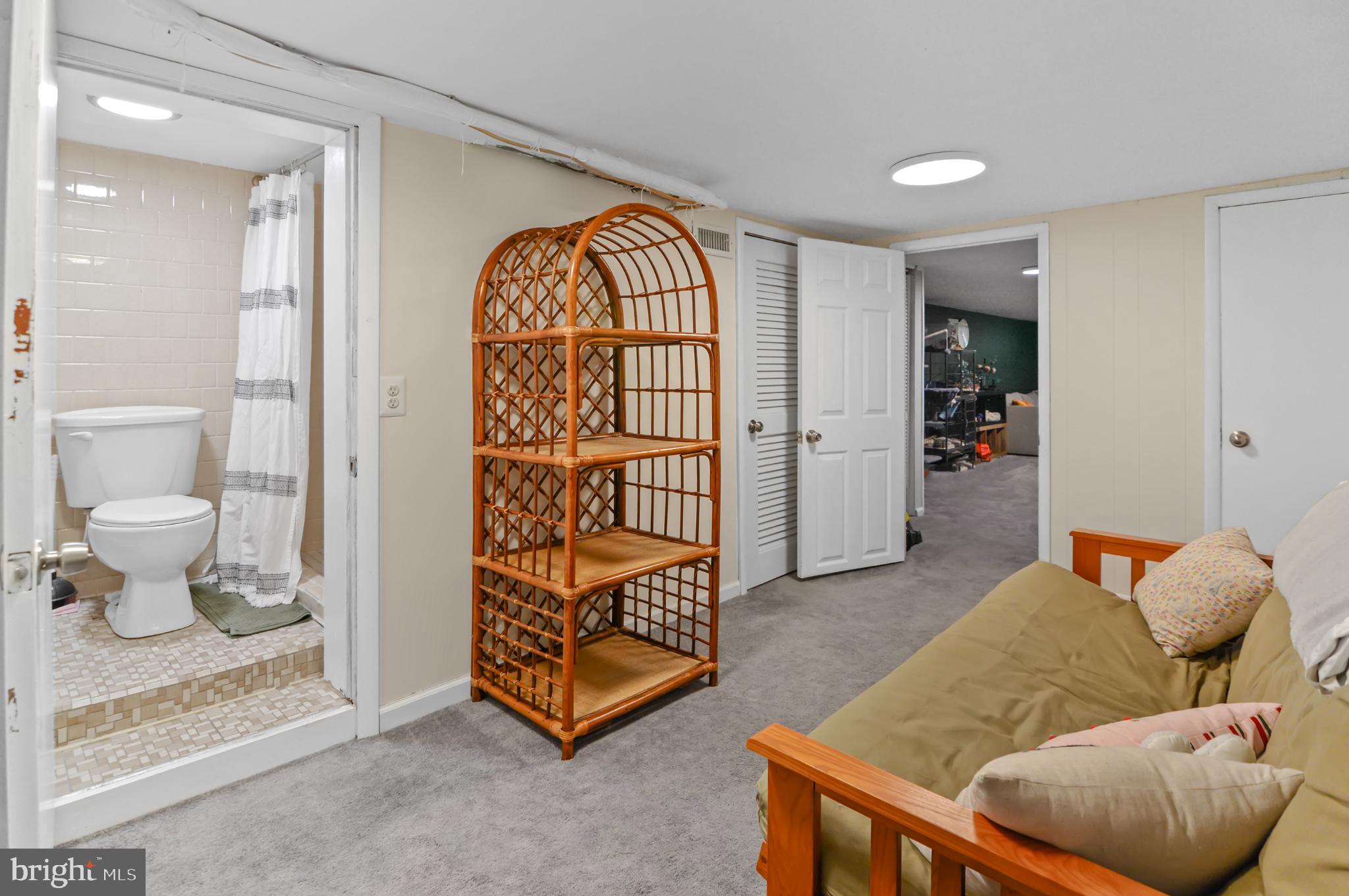 505 South Lehigh Street Baltimore, MD 21224 - Photo 22 of 25 a living room with furniture and a painting on the wall