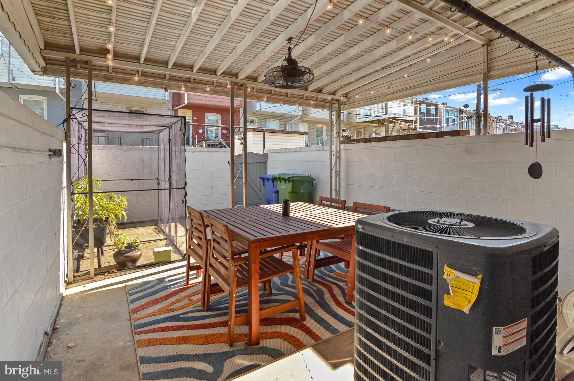 505 South Lehigh Street Baltimore, MD 21224 - Photo 24 of 25 a roof deck with table and chairs