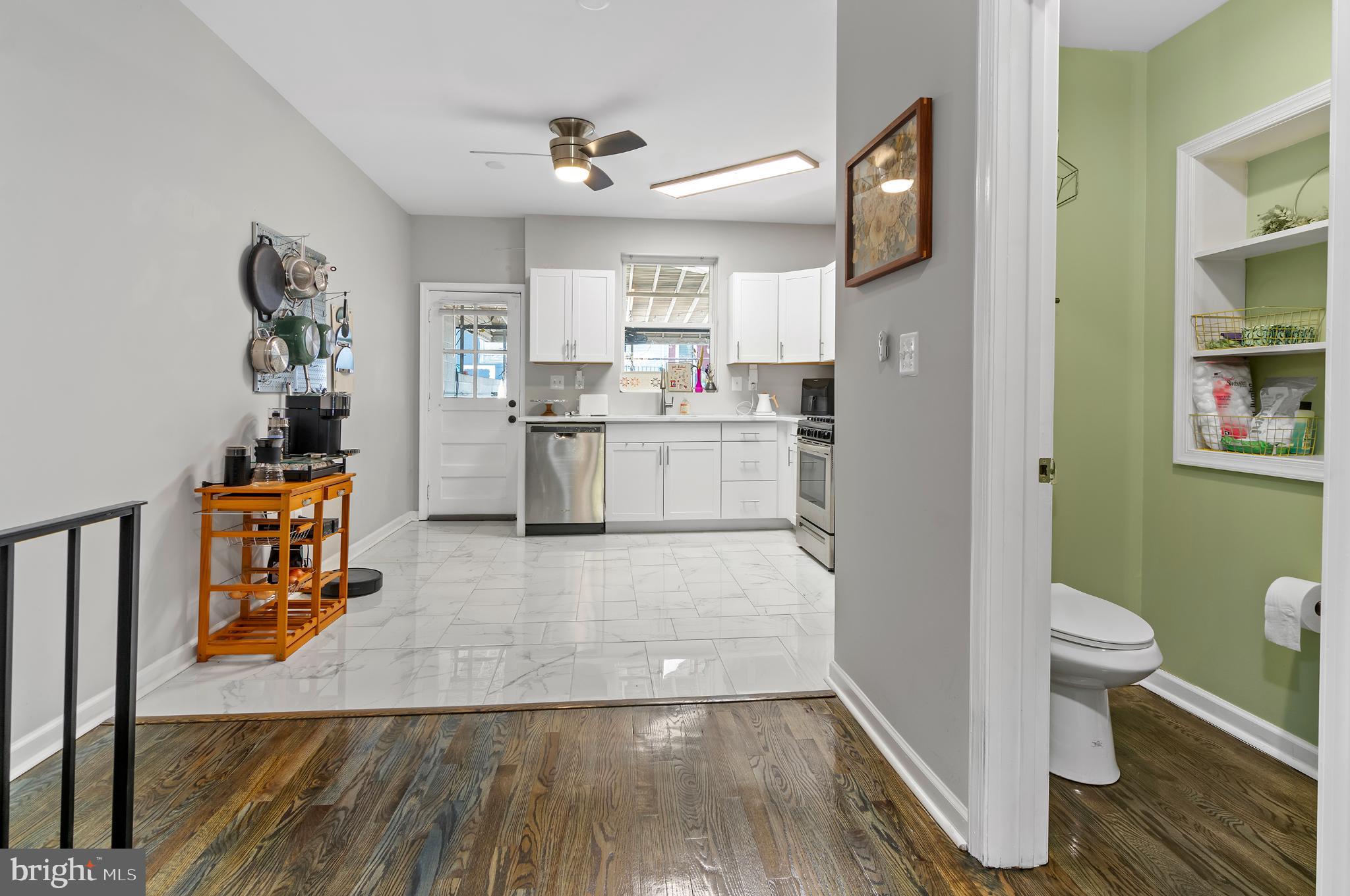 505 South Lehigh Street Baltimore, MD 21224 - Photo 8 of 25 a kitchen with a sink and wooden floor