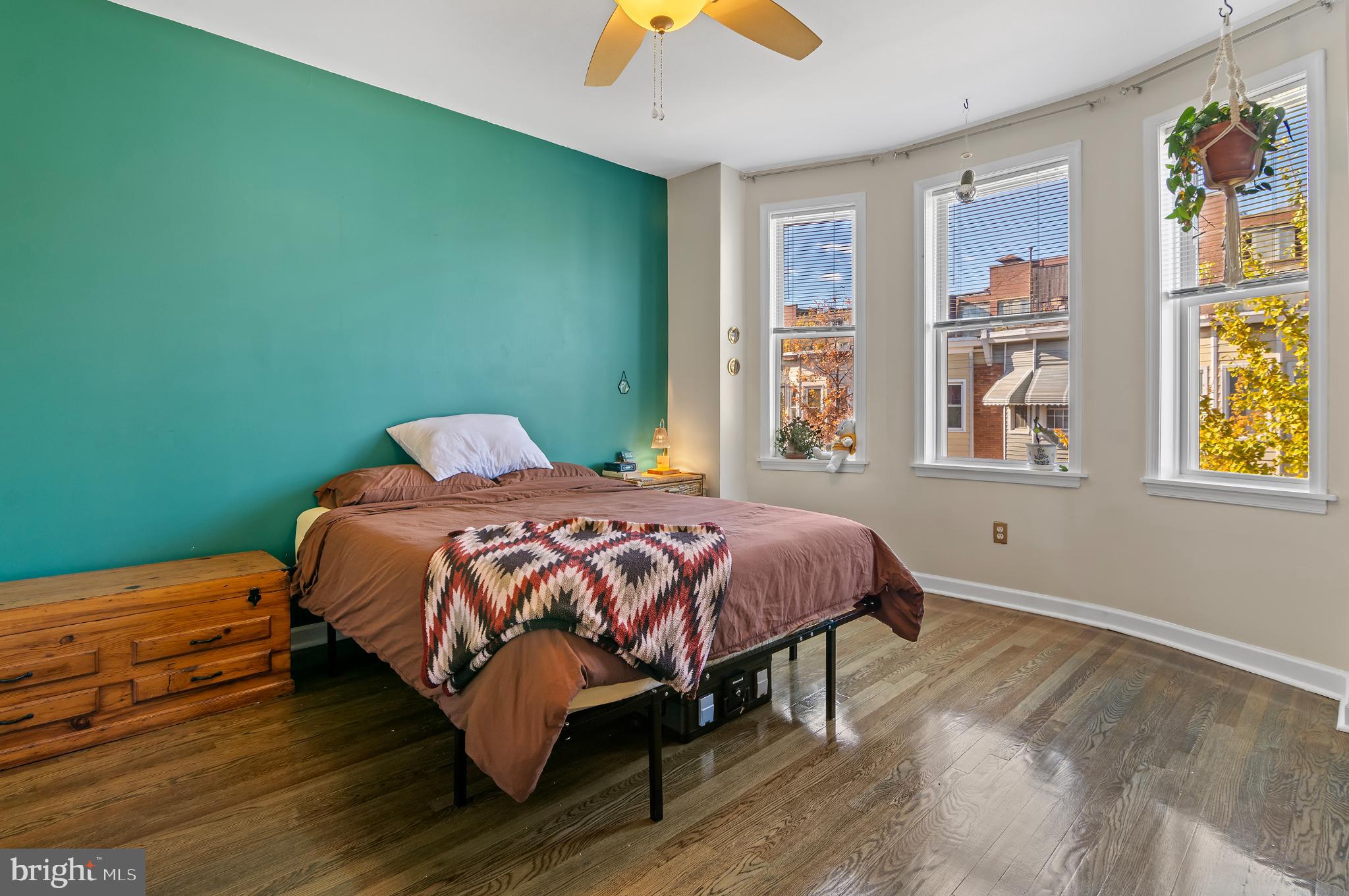 505 South Lehigh Street Baltimore, MD 21224 - Photo 10 of 25 a bedroom with a bed and a painting on the wall