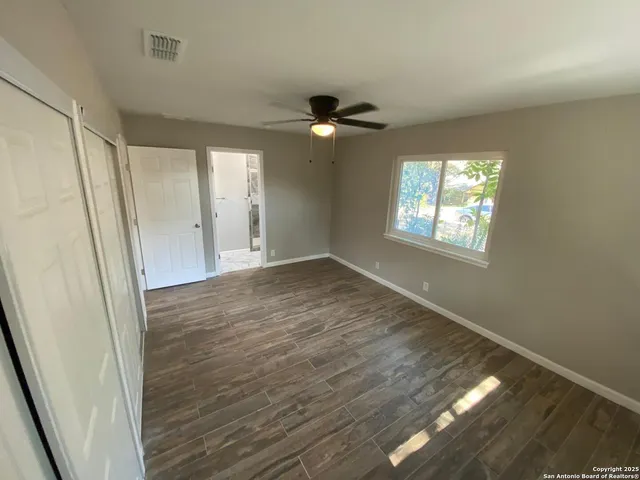a bathroom with a toilet a sink and a shower