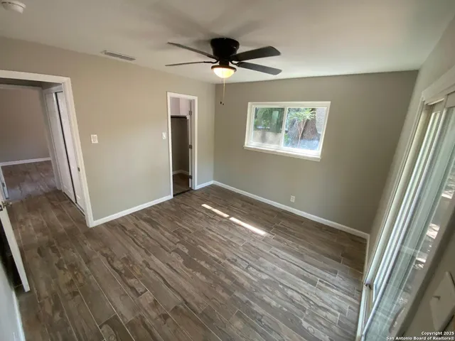a bathroom with a sink vanity mirror and toilet