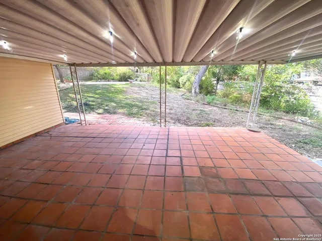 a view of backyard with large windows