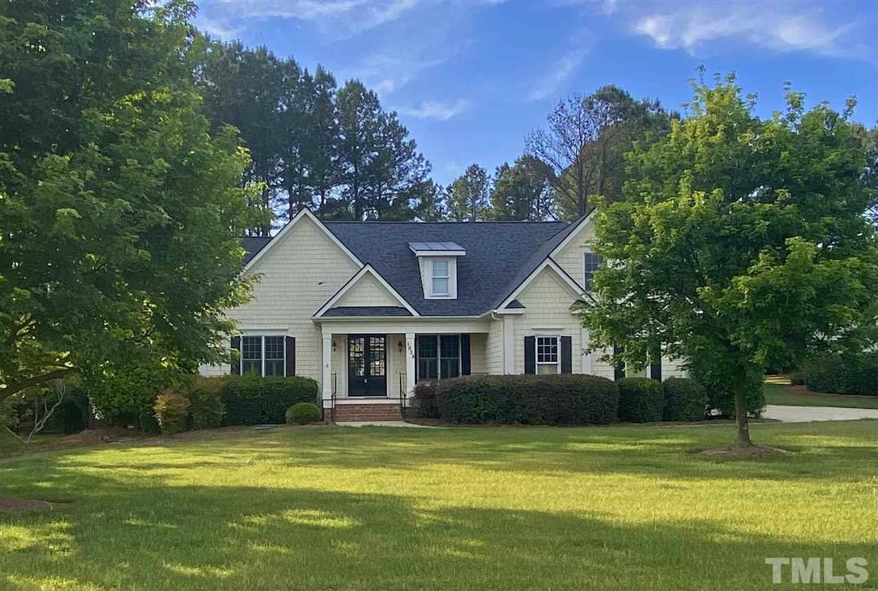 a view of a house with a swimming pool