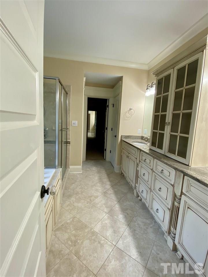 1028 Raleigh, NC 27603 - Photo 20 of 24 a large bathroom with a tub and shower