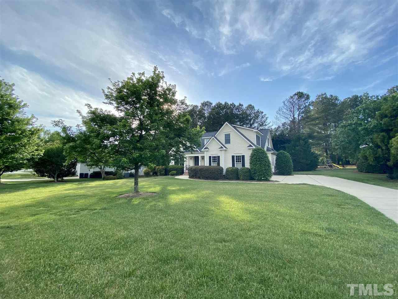 1028 Raleigh, NC 27603 - Photo 3 of 24 a house with huge green field in front of it