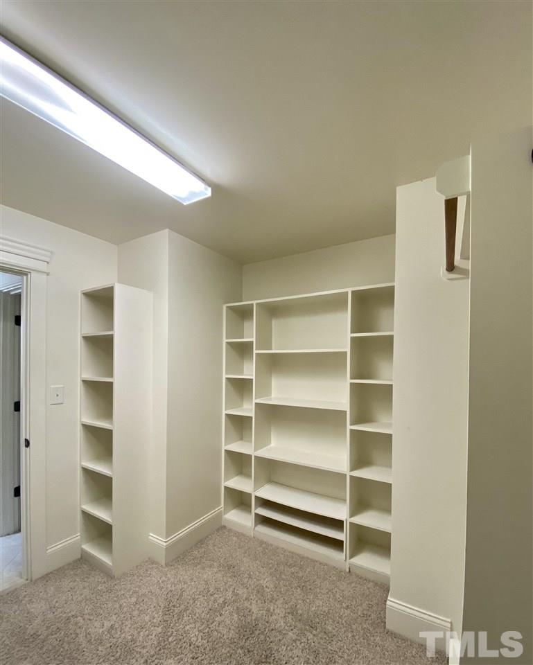 1028 Raleigh, NC 27603 - Photo 24 of 24 a view of walk in closet with empty racks