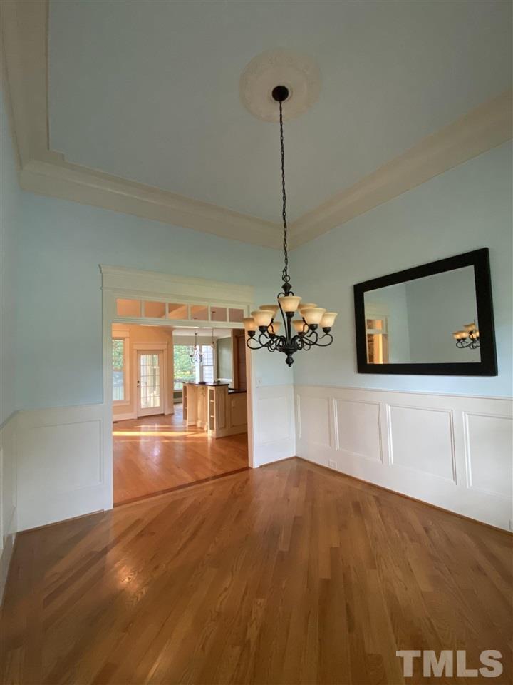 1028 Raleigh, NC 27603 - Photo 6 of 24 a view of empty room with a kitchen