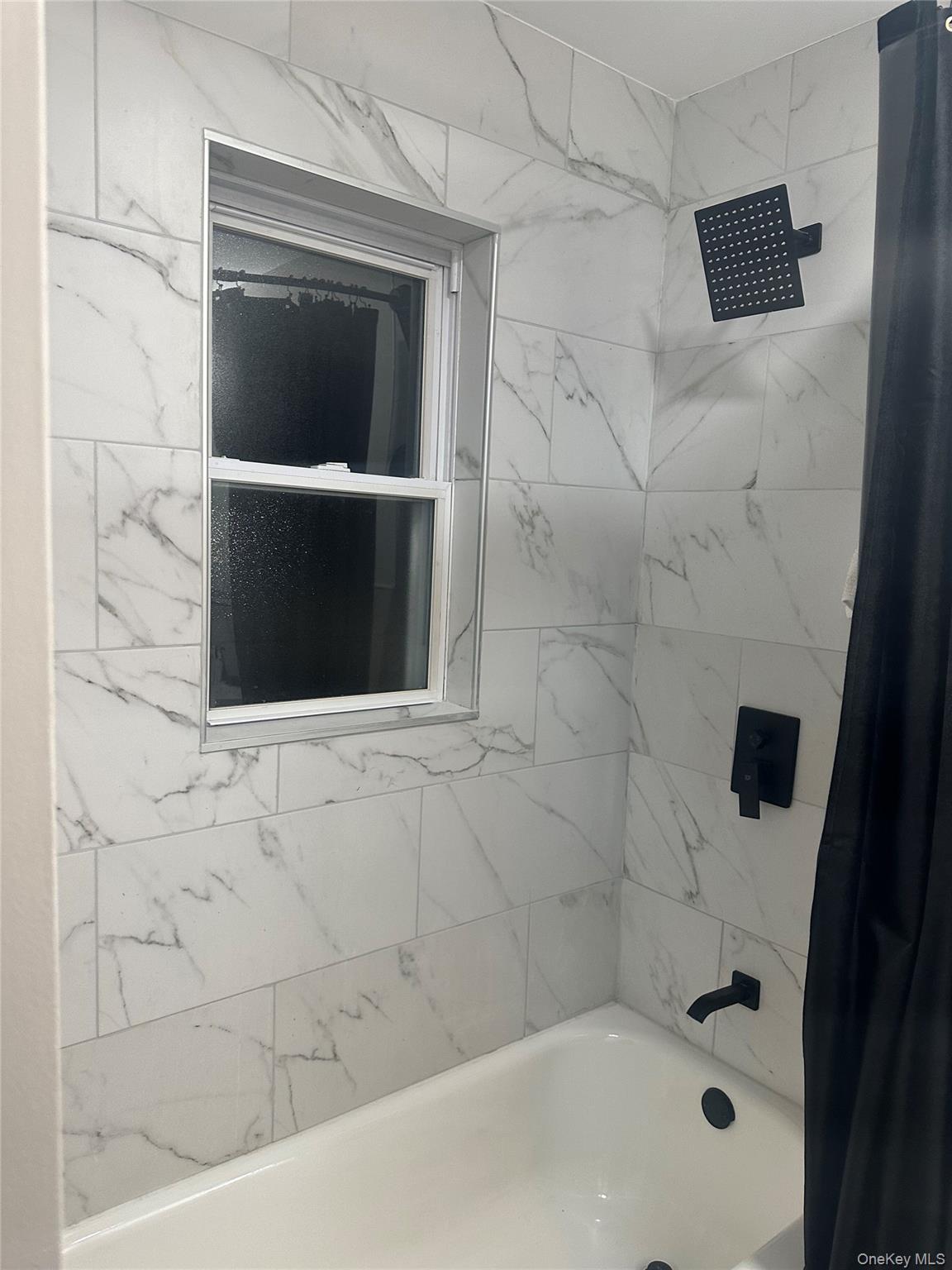 Undisclosed Address West Babylon, NY 11704 - Photo 8 of 8 a bathroom with a shower and bathtub