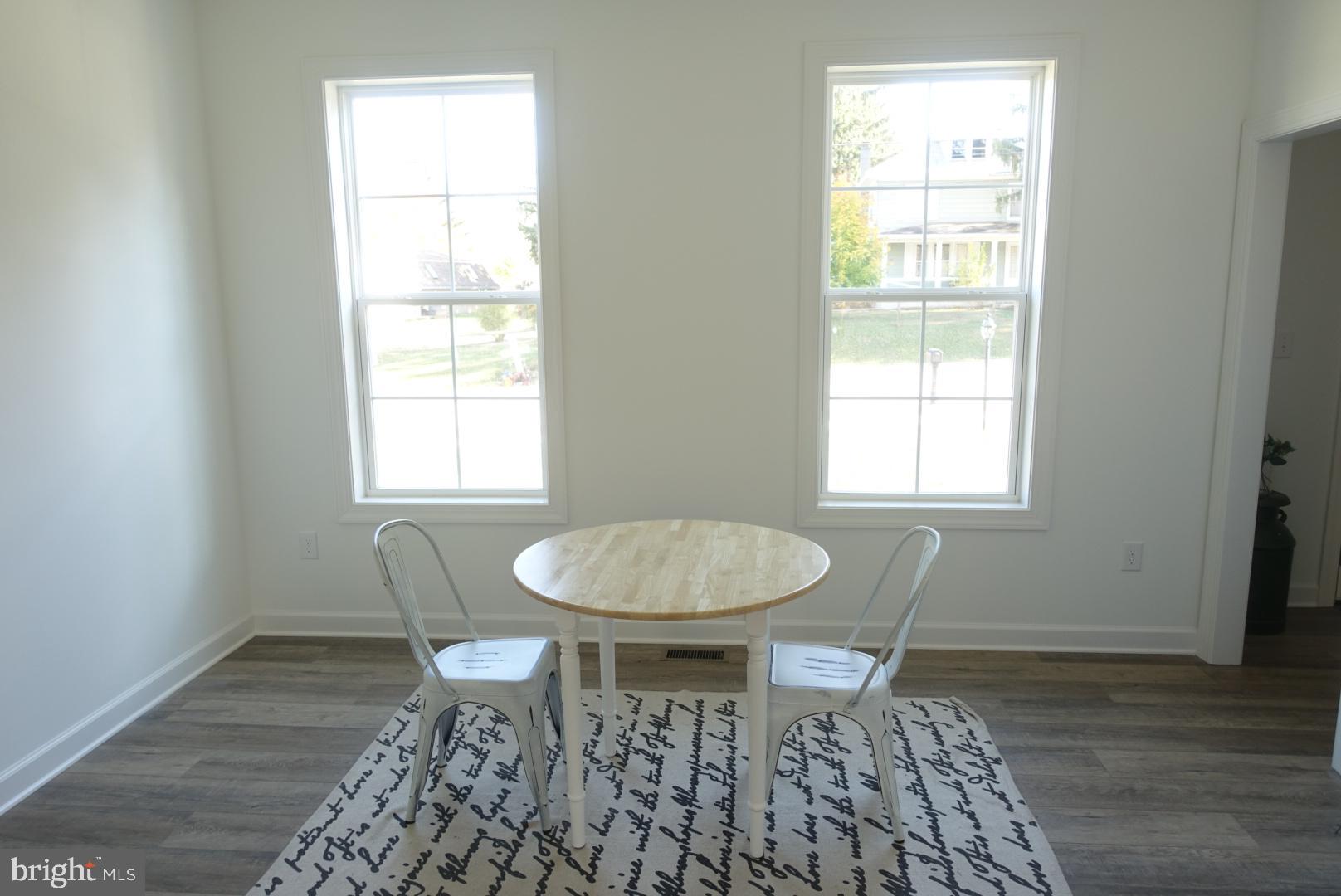 221 Kinneman Road, Unit 28 Abbottstown, PA 17301 - Photo 11 of 26 a dining room with table chairs and a window