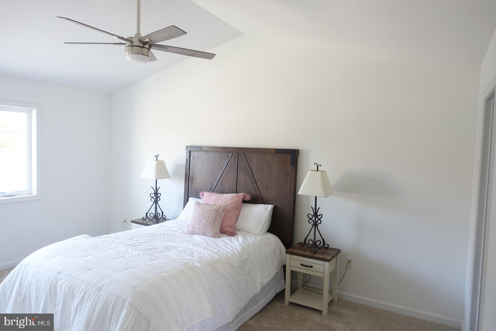 221 Kinneman Road, Unit 28 Abbottstown, PA 17301 - Photo 12 of 26 a bedroom with a bed and a ceiling fan