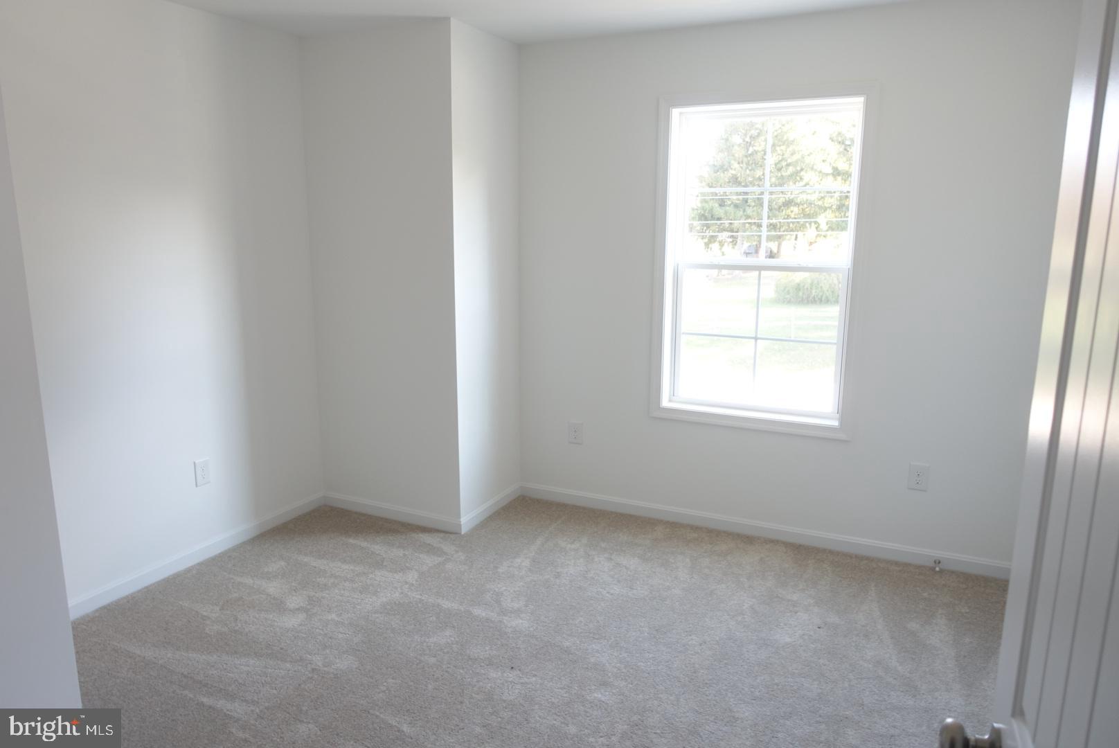 221 Kinneman Road, Unit 28 Abbottstown, PA 17301 - Photo 18 of 26 an empty room with a window