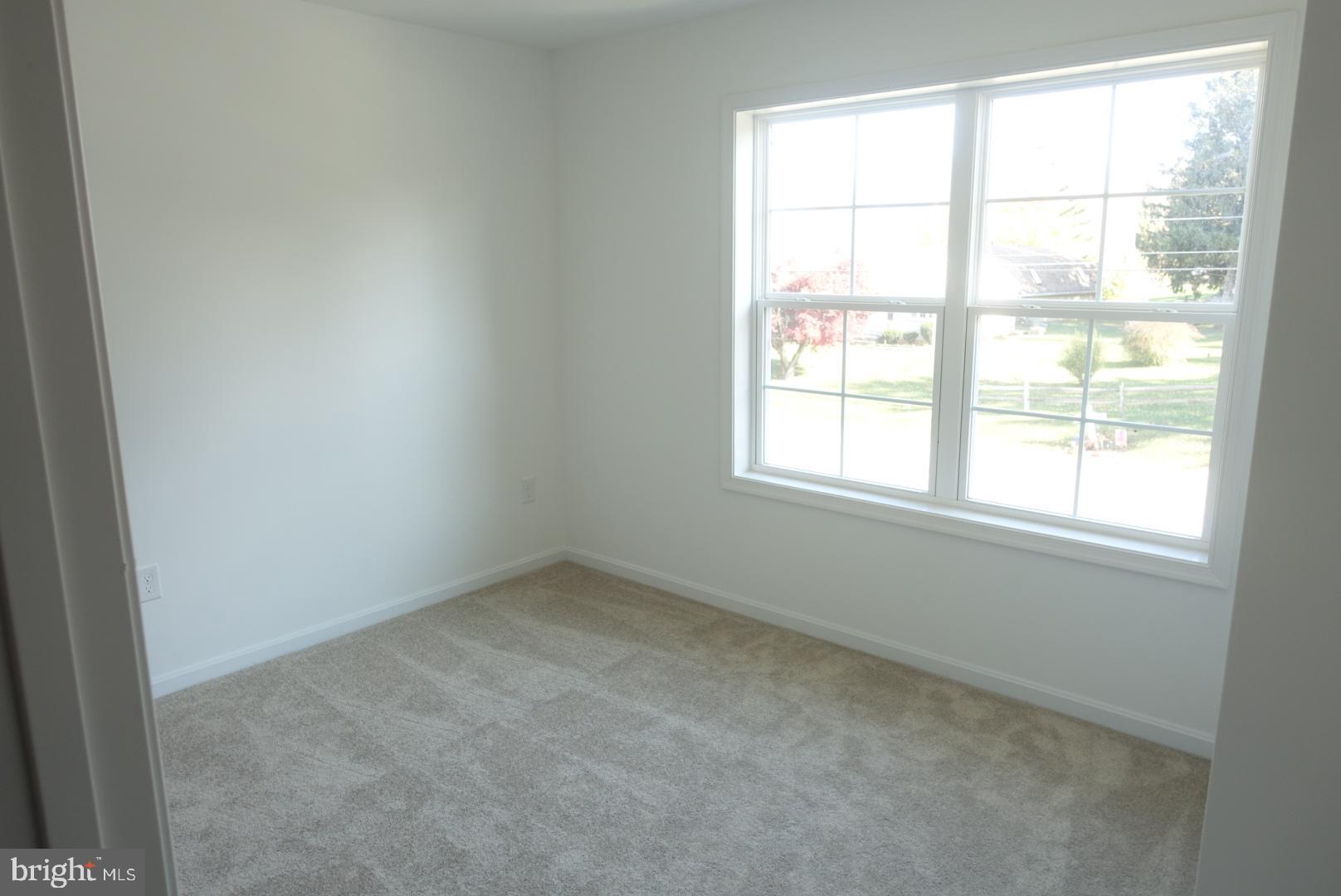 221 Kinneman Road, Unit 28 Abbottstown, PA 17301 - Photo 19 of 26 an empty room with a window