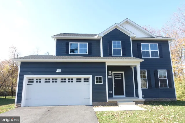 a front view of a house with a garage