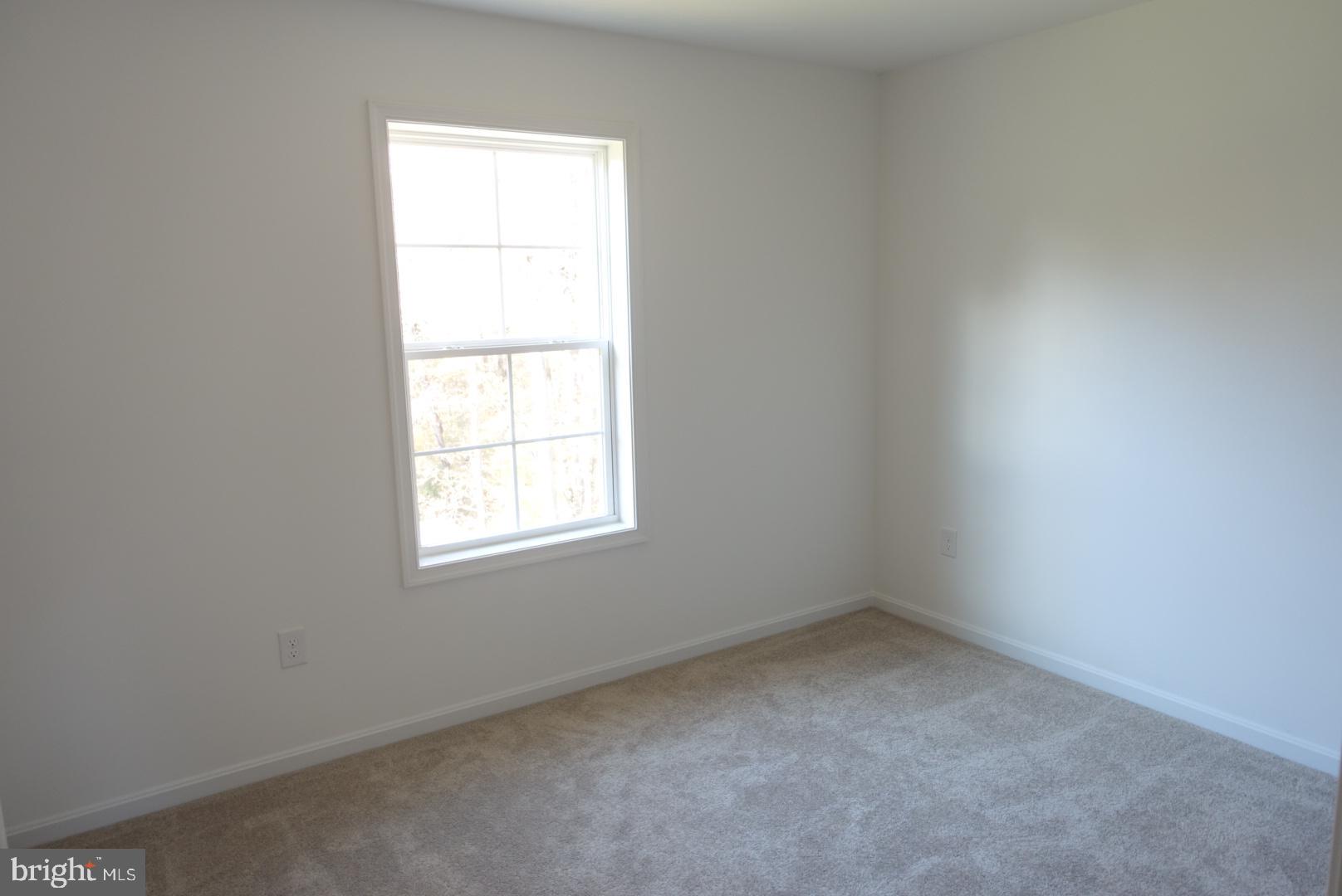 221 Kinneman Road, Unit 28 Abbottstown, PA 17301 - Photo 21 of 26 an empty room with a window