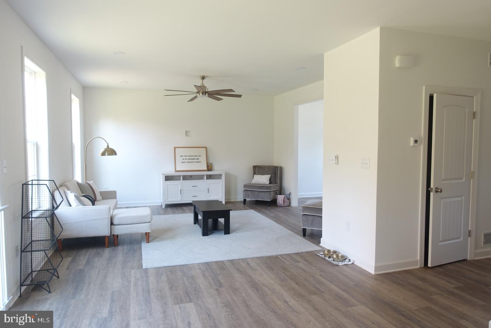 221 Kinneman Road, Unit 28 Abbottstown, PA 17301 - Photo 7 of 26 a living room with furniture and a wooden floor